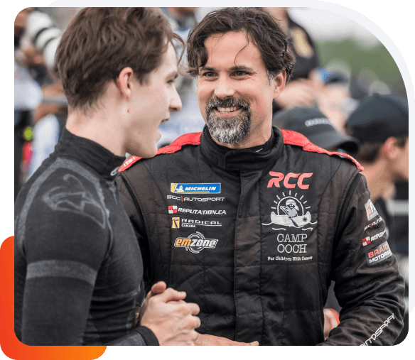 Daniel Earle Daniel Earle, captain of Team Earle and president and CEO of Highlander Silver, in racing fatigues speaking with another team member