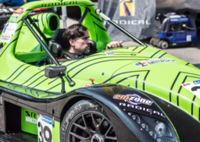 Daniel Earle, captain of Team Earle and president and CEO of Highlander Silver, piloting #39 Radical SR3 XX, painted green