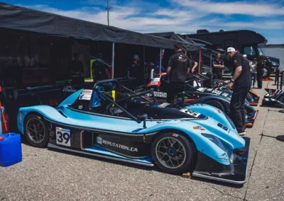 Blue race car driving on track